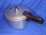 Presto Pressure Cooker Qt 0124001 W/ Jiggler & Trivet Insert. Fixed Price $15.98.