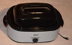 Oster Roaster Oven Quart Silver CKSTRS18-VHD-V Self-basting Lid. Fixed Price $90.00.