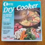 Vintage 1993 K-tel Dry Cooker New Open Box With Recipe Booklet. Fixed Price $22.00.