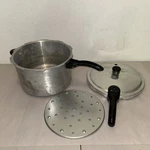 Presto Pressure Cooker 409A 6 Quart Model 0128204 With Jiggler And Insert Rack. Fixed Price $39.99.