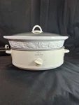 Rival Slow Cooker 5 Qt Oval Crock Pot Vines White Stoneware SCE600 Cottage-core. Fixed Price $60.00.