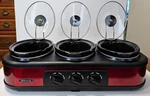Bella Triple Slow Cooker And Buffet Server Red YDE1121. Fixed Price $24.95.