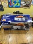 Oster CKSTRS20-SBHVW 26 Pound Turkey Roaster Oven 20-QUART Capacity Stainless. Fixed Price $60.00.