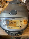 Zojirushi NP-HCC10XH Induction Heating System Rice Cooker & Warmer 5 Cup. Fixed Price $275.00.