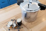 16.9 Qt Manual Pressure Canner & Cooker With Gauge, Locking Lid Guard. Fixed Price $221.99.
