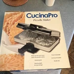 Cucinapro Polished Pizzelle Maker Electric Metal Silver Model 220-05P. Fixed Price $82.00.