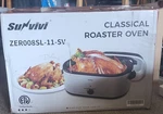 Survivi Electric Non-stick Oval Roaster Oven Silver Black With Lid ZER008SL-11-. Fixed Price $50.00.