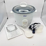Oster 7-CUP Electric Rice Cooker 4704 White W/ Keep Warm Function & Glass Lid. Fixed Price $19.95.