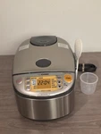 Zojirushi Induction Heating System Rice Cooker & Warmer 5.5 Cups NP-HCC10. Fixed Price $299.95.